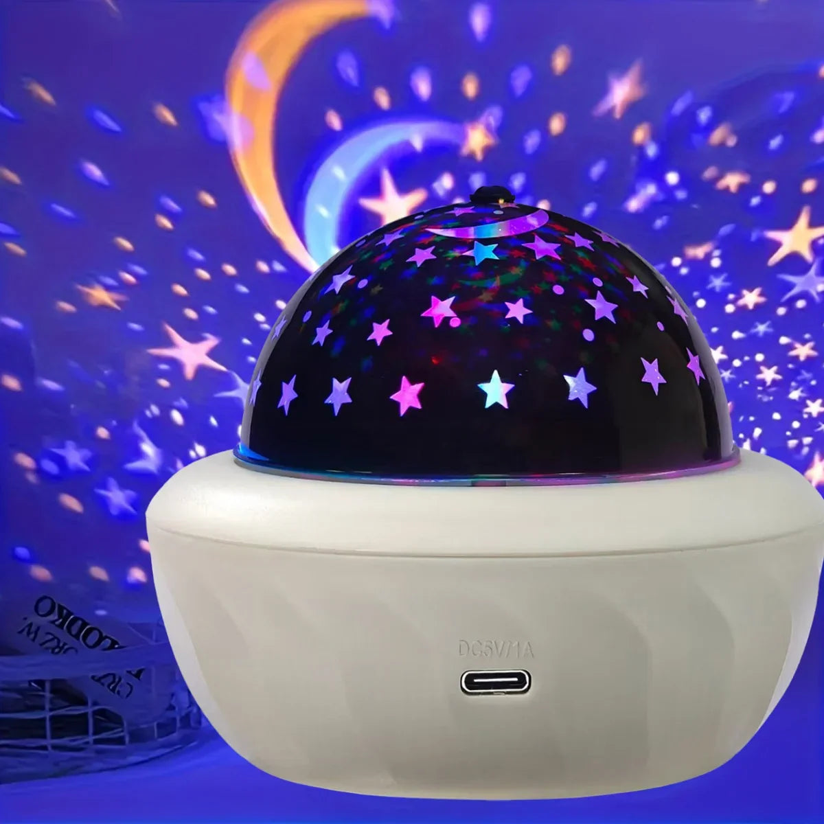 Moon and star projection covering a wall and ceiling