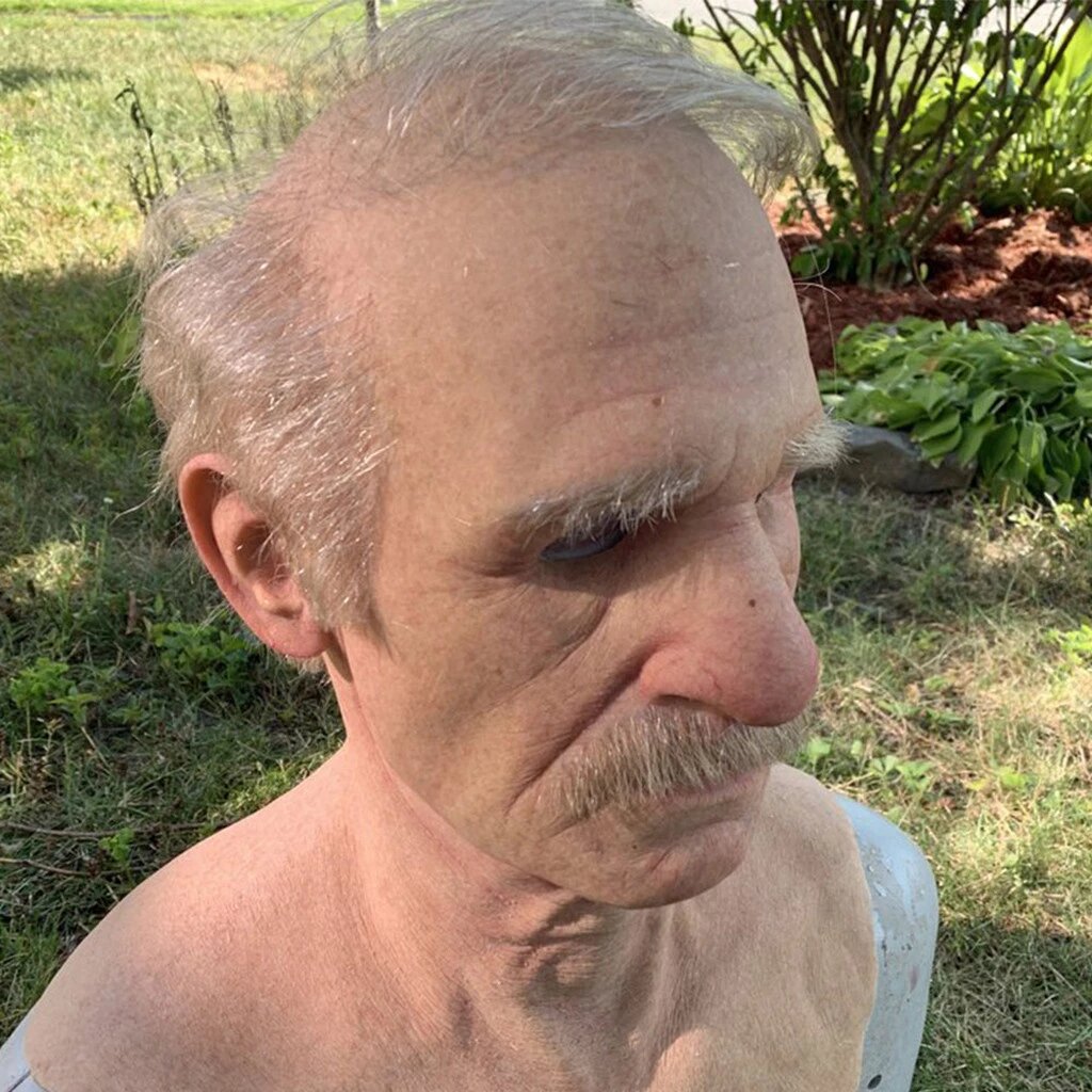 Full-head elderly man mask worn for a costume party disguise