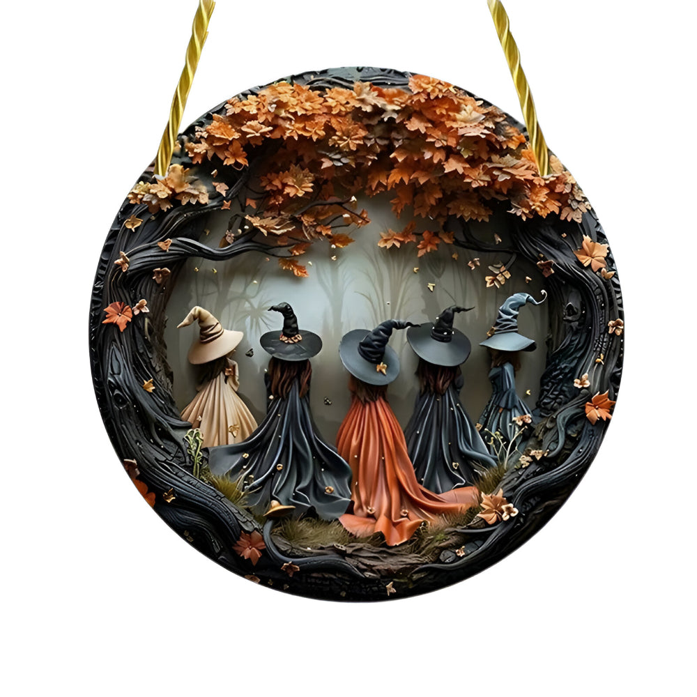 Detail of the layered witch figures on the wooden door decor sign