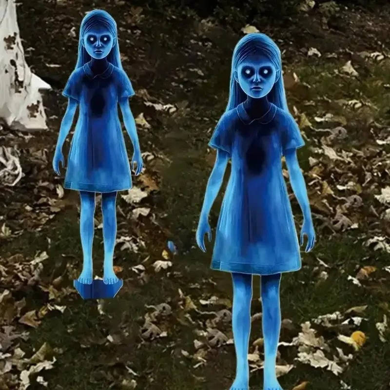 Halloween ghost figure staked on a lawn at dusk