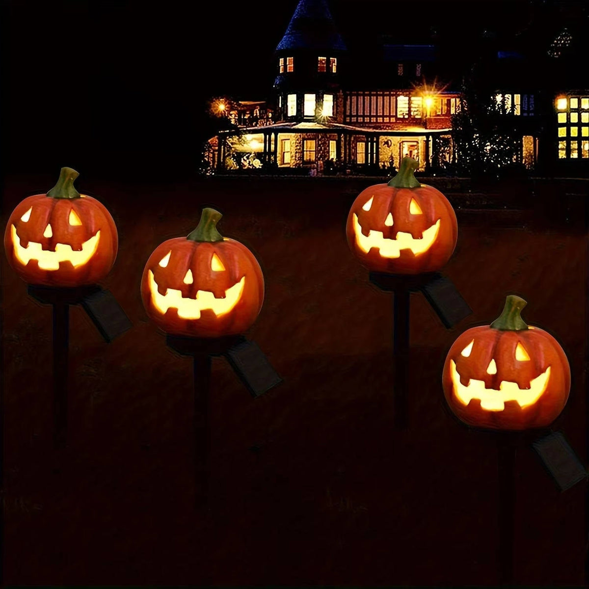 Row of pumpkin solar lights lining a Halloween pathway