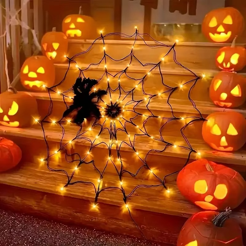 Four foot wide spider web light mounted outdoors at night