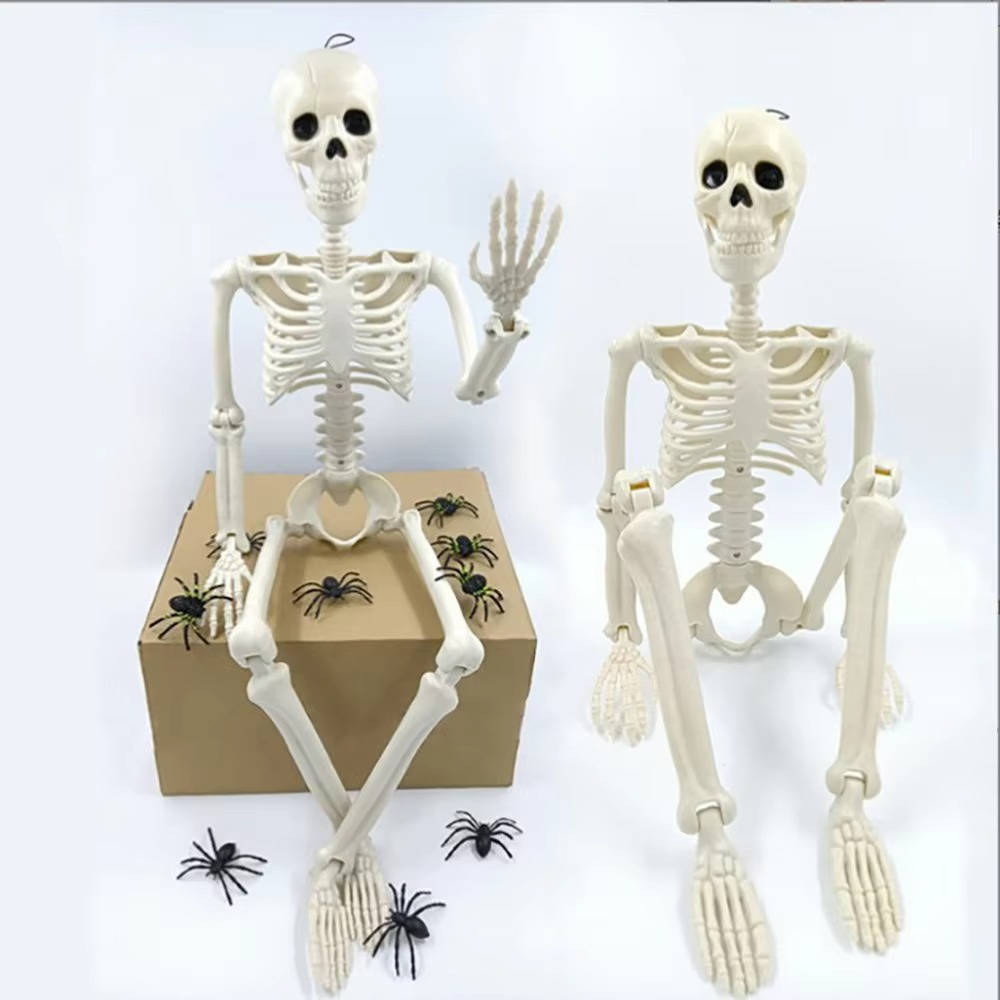 Skeleton yard decoration hanging from a tree branch