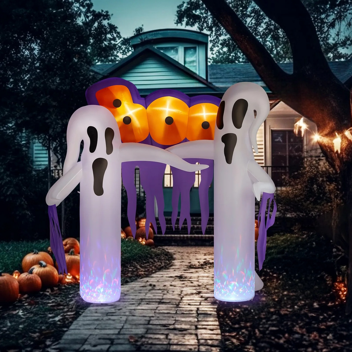 Inflatable Halloween clown archway lit up in a front yard