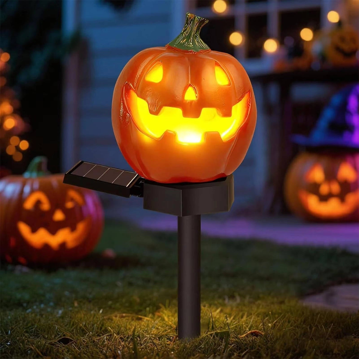Pumpkin shaped solar stake light in a garden bed