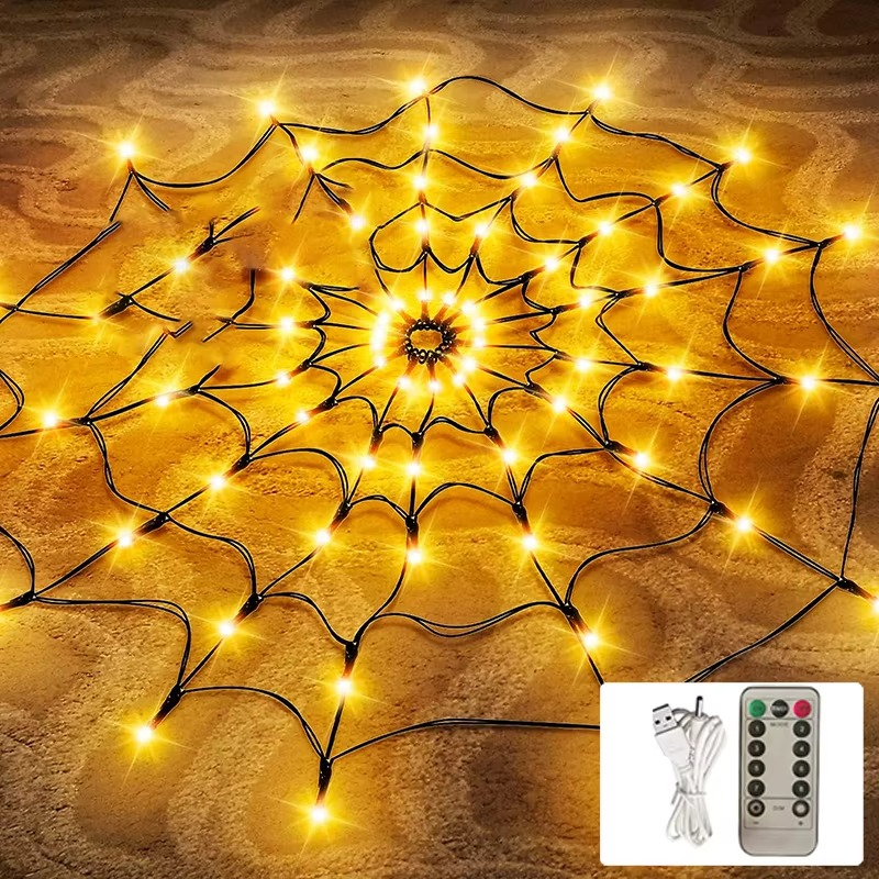 Orange LED Halloween spider web light hung over a doorway