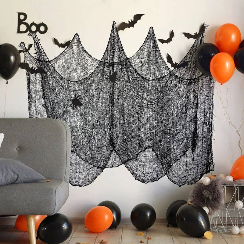 Halloween yard decoration cloth hung from tree branches