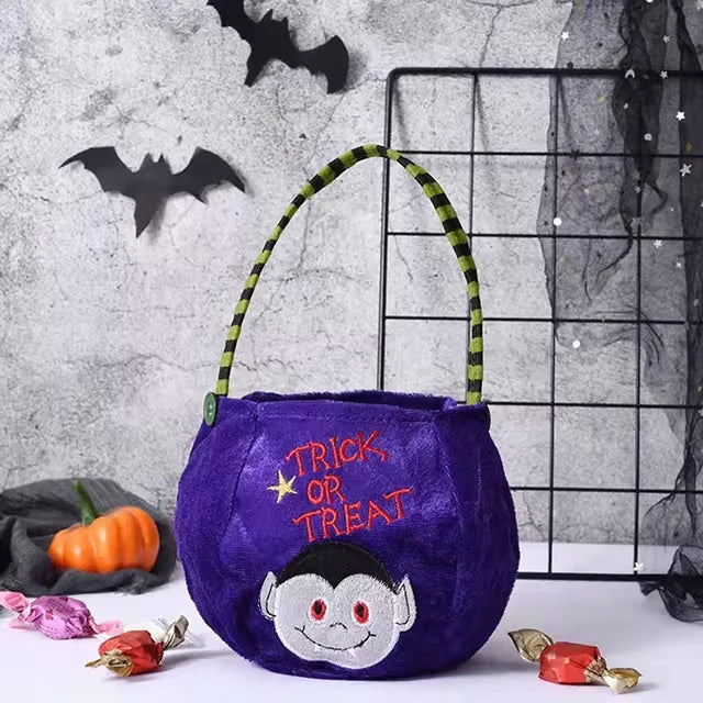 Purple pumpkin-shaped Halloween treat bag for kids with adjustable strap